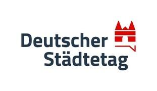 Logo des Deutschen Städtetags mit rotem Wappen und Schriftzug in dunkelblauem Schriftzug.